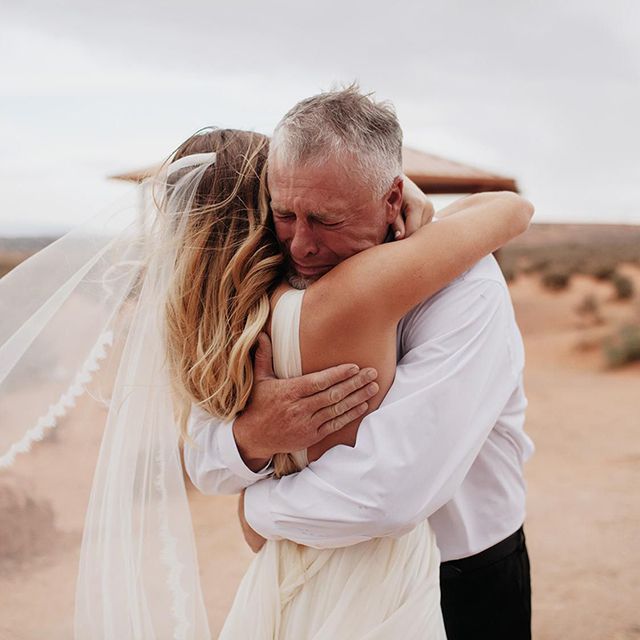 dad and bride hugging
