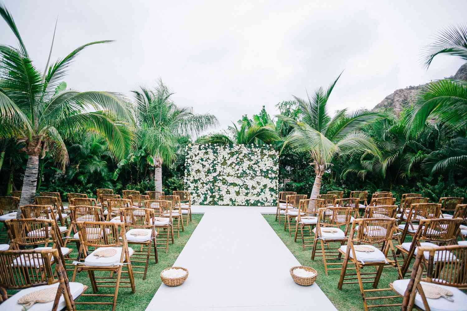 Ceremony venue with white runner on grass