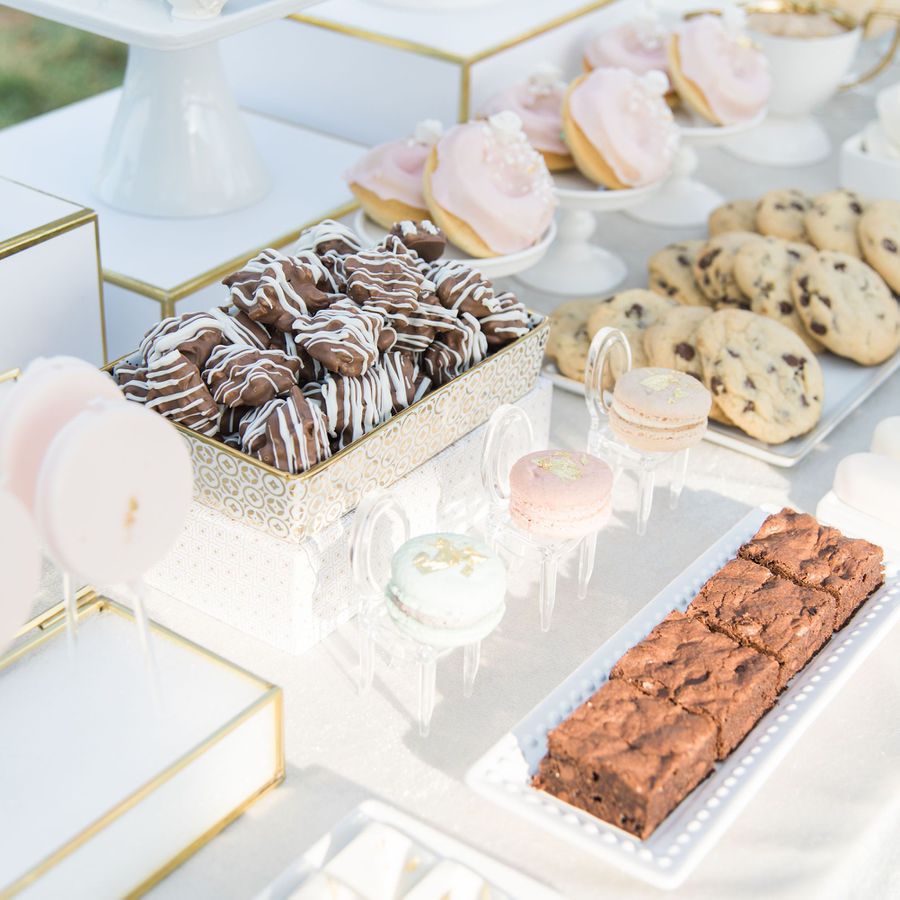 Wedding desserts include macarons, donuts, and cookies