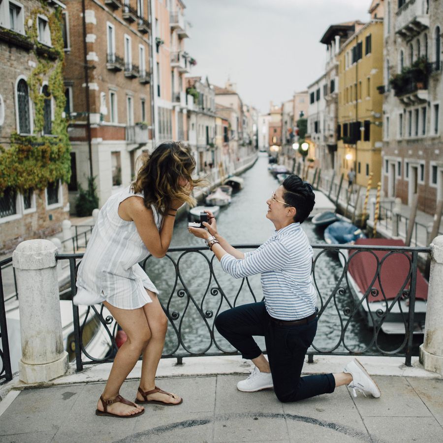 Woman proposing on one knee