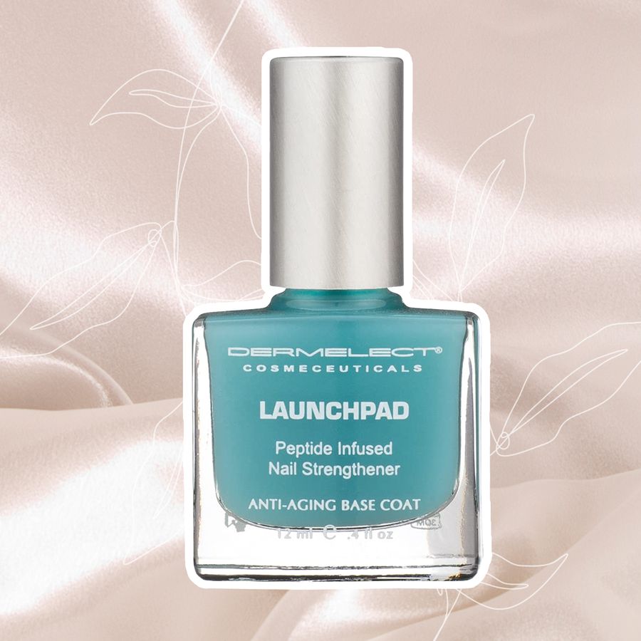 Dermelect Launchpad Nail Strengthener displayed on a realistic fabric background overlaid with floral sketches