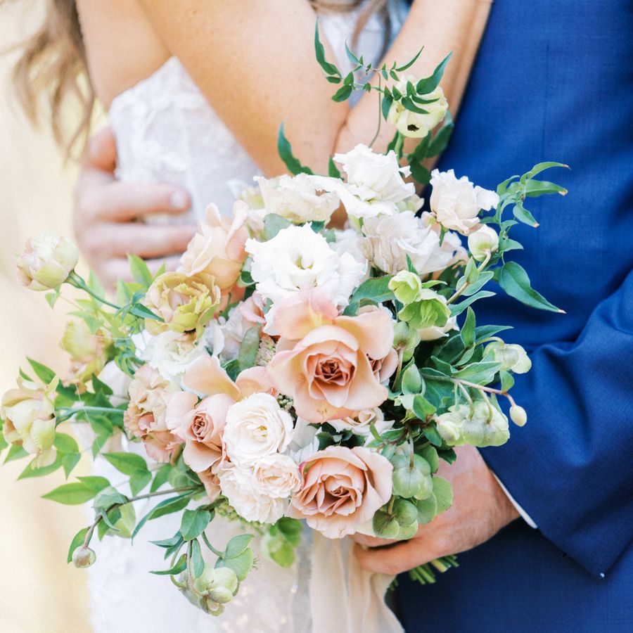 colorful bouquet with peach and white roses