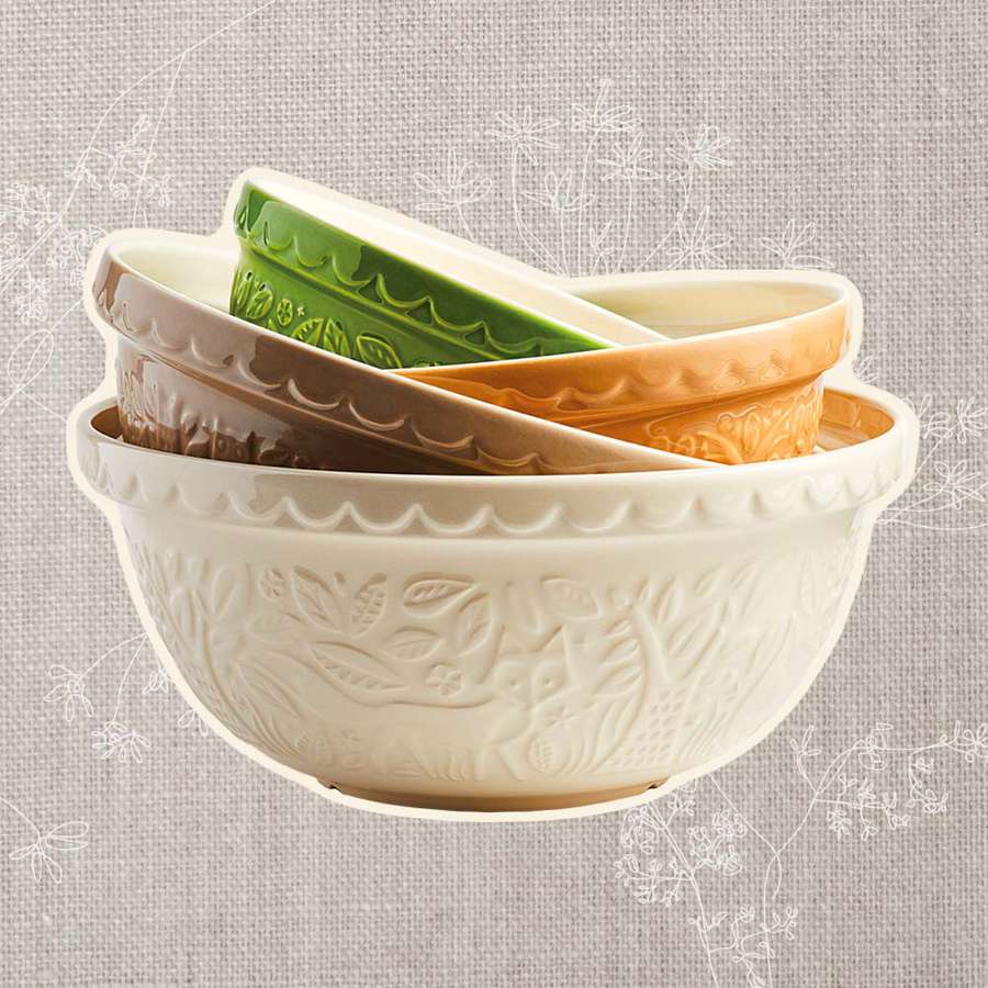 A collage of stacked bowls we recommend on a beige linen background