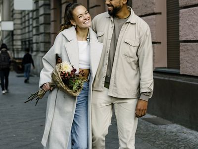 Female holding bouquet of flowers her boyfriend bought for her