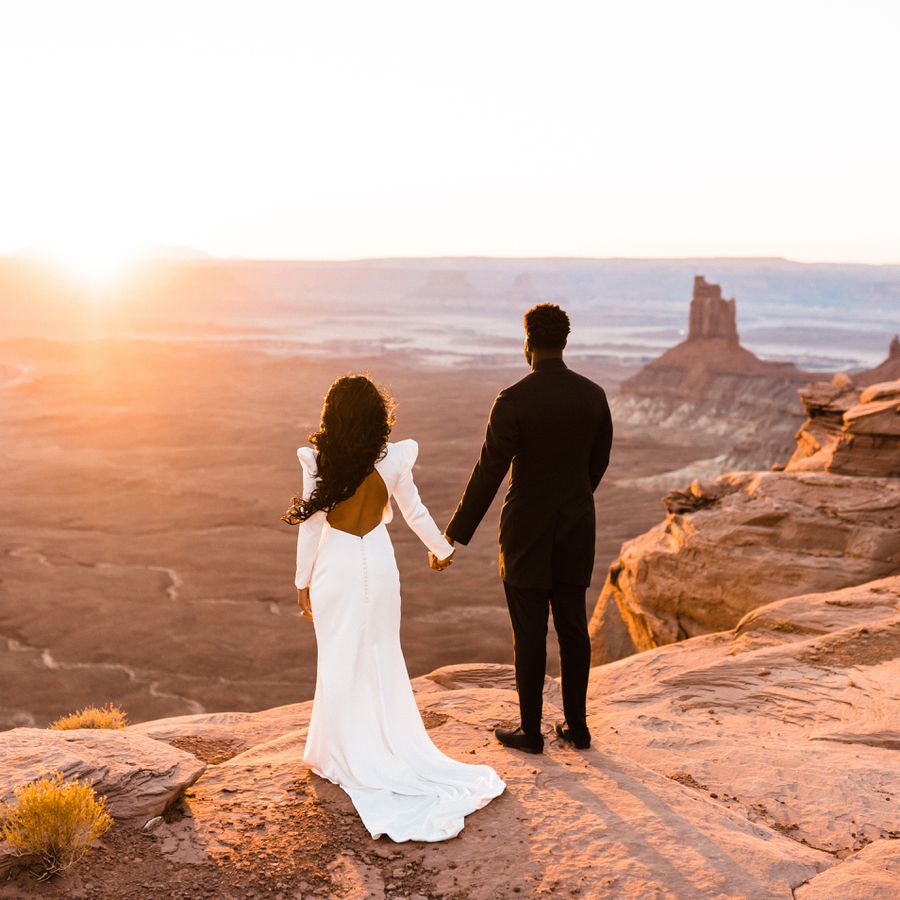 bride and groom looking at desert