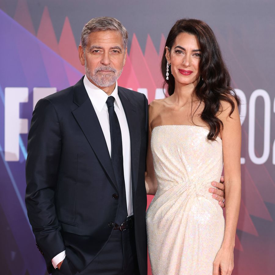 George and Amal Clooney posing on the red carpet at the London Film Festival 