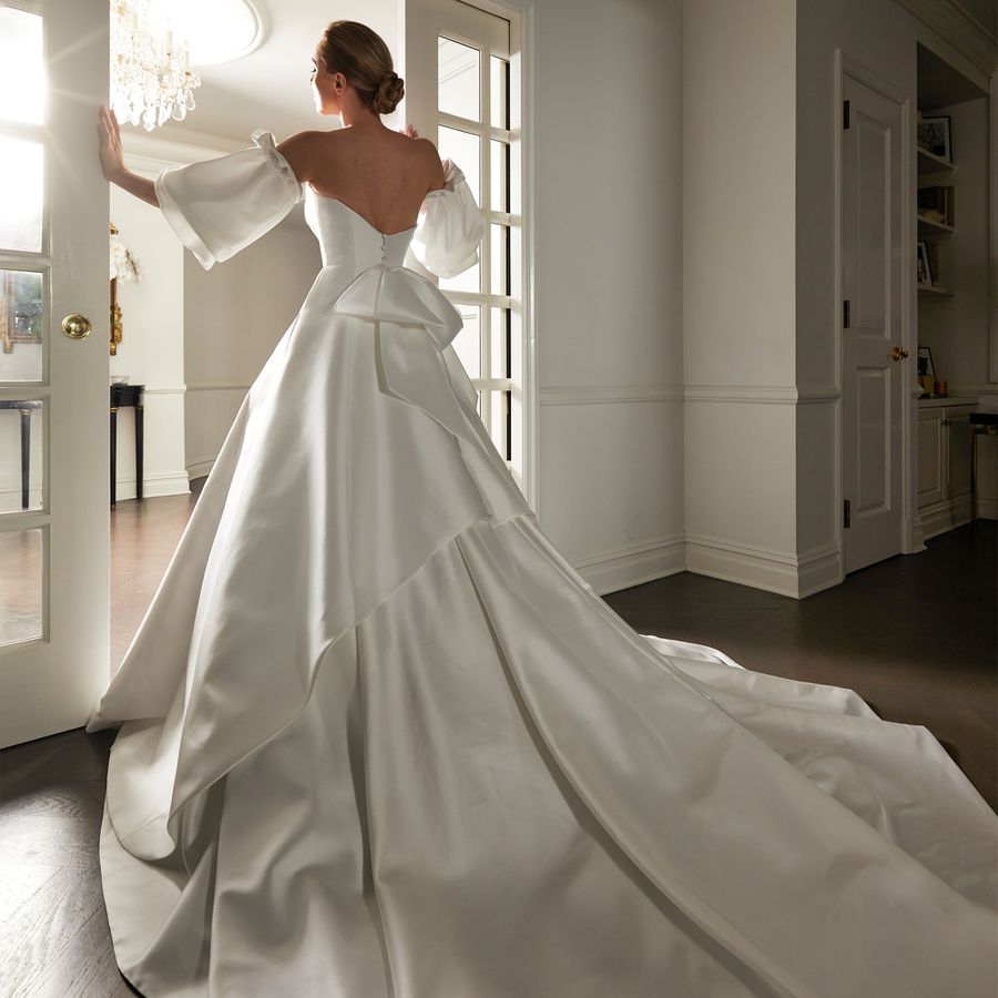 Porcelain White Ballgown With Ruffled Bodice and Dramatic Sleeves