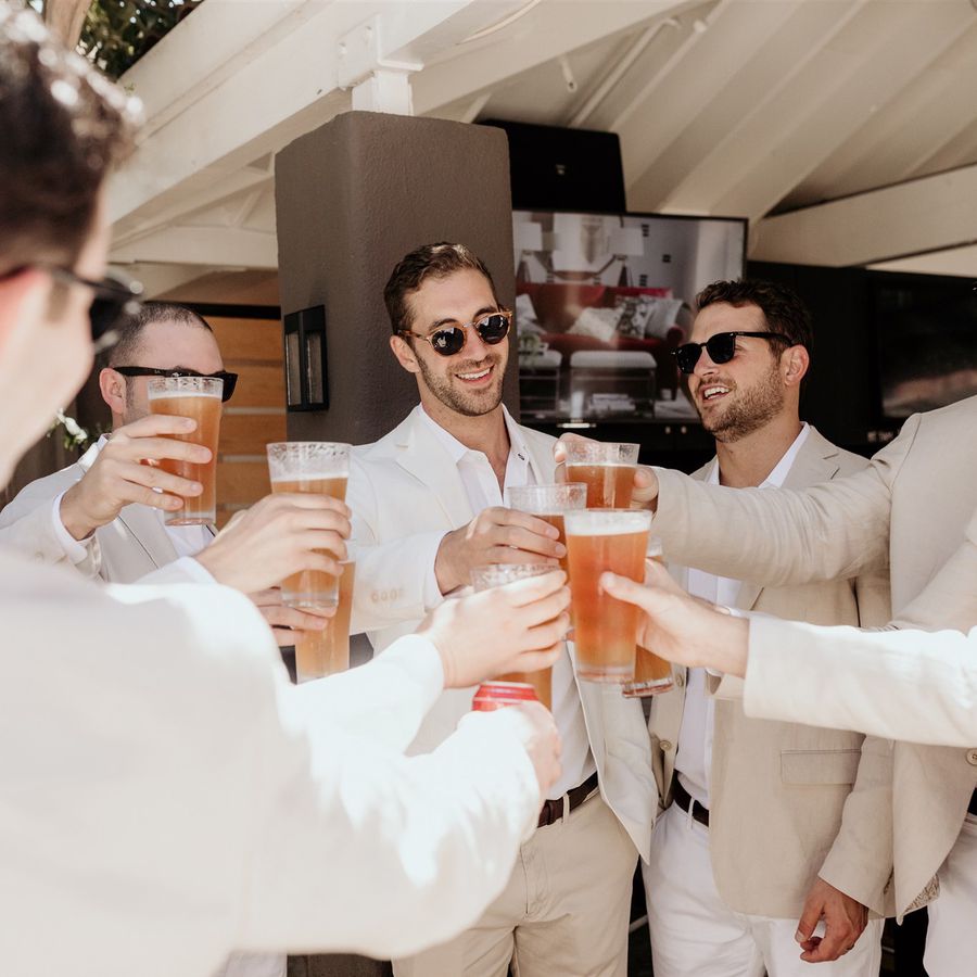groomsmen holding beers