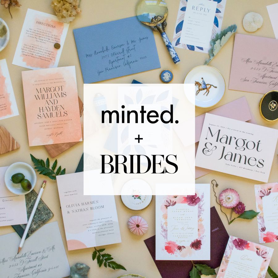 Minted + Brides wedding invitations and stationary items displayed on a yellow table
