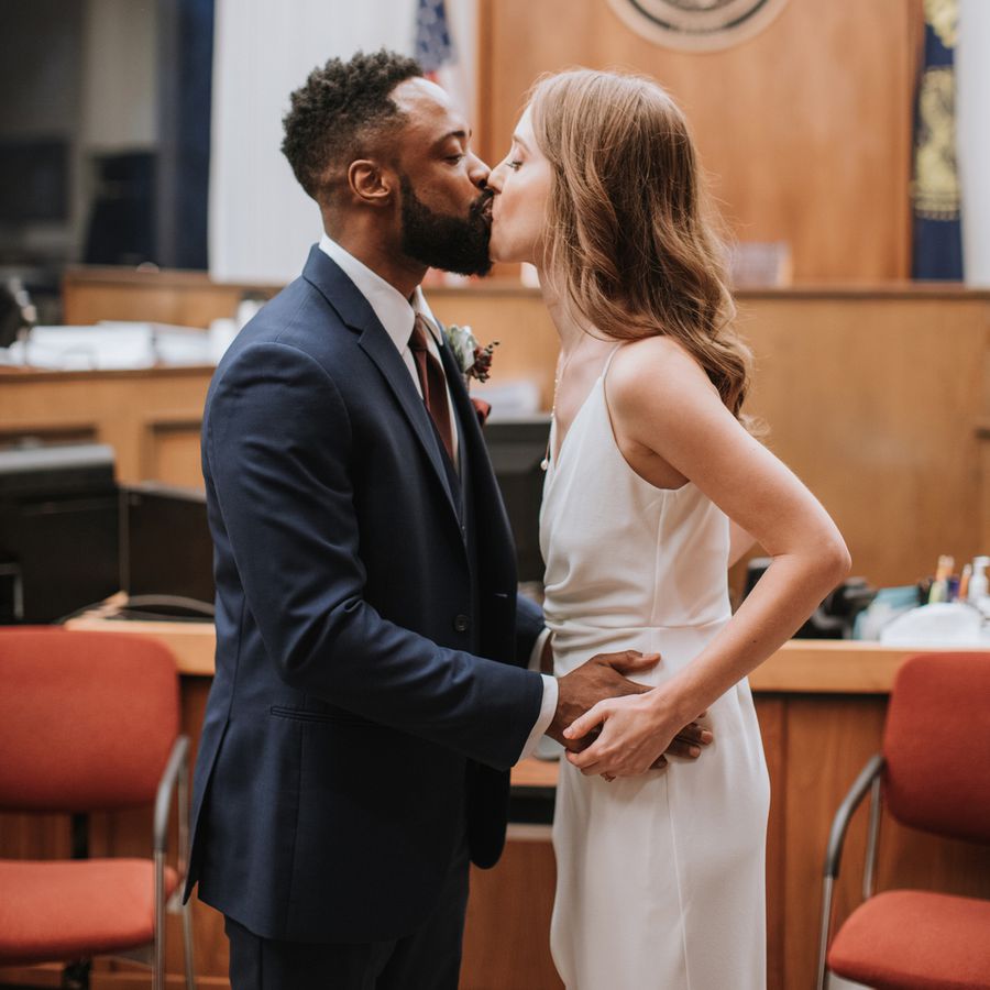 couple kissing during their civil ceremony at a courthouse