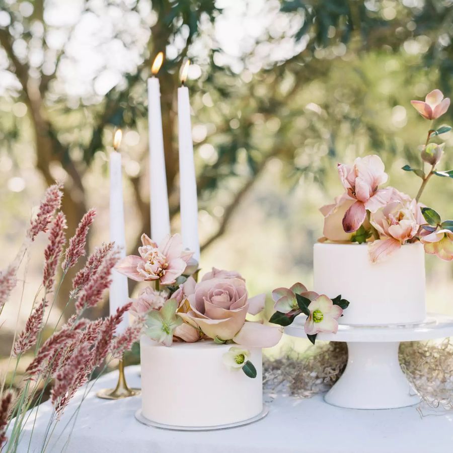 two single-tiered wedding cakes