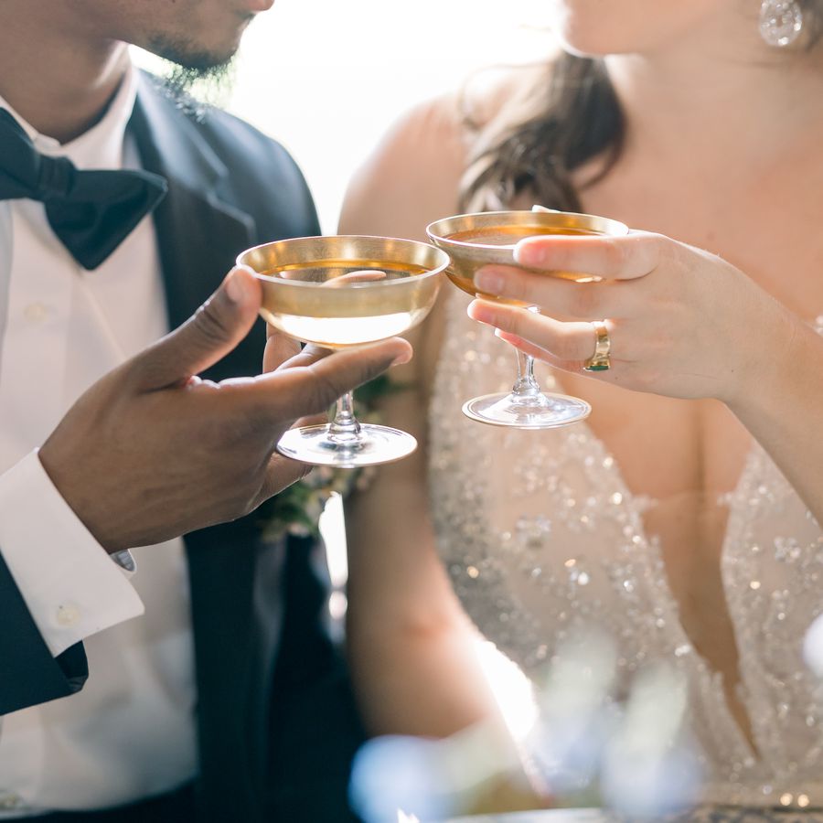 newlyweds toast with Champagne
