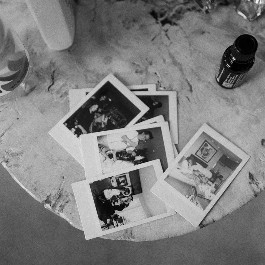Wedding Getting-Ready Polaroid Photos on Marble Table