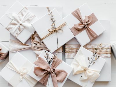 White Gift Boxes Wrapped with Pink and White Ribbons