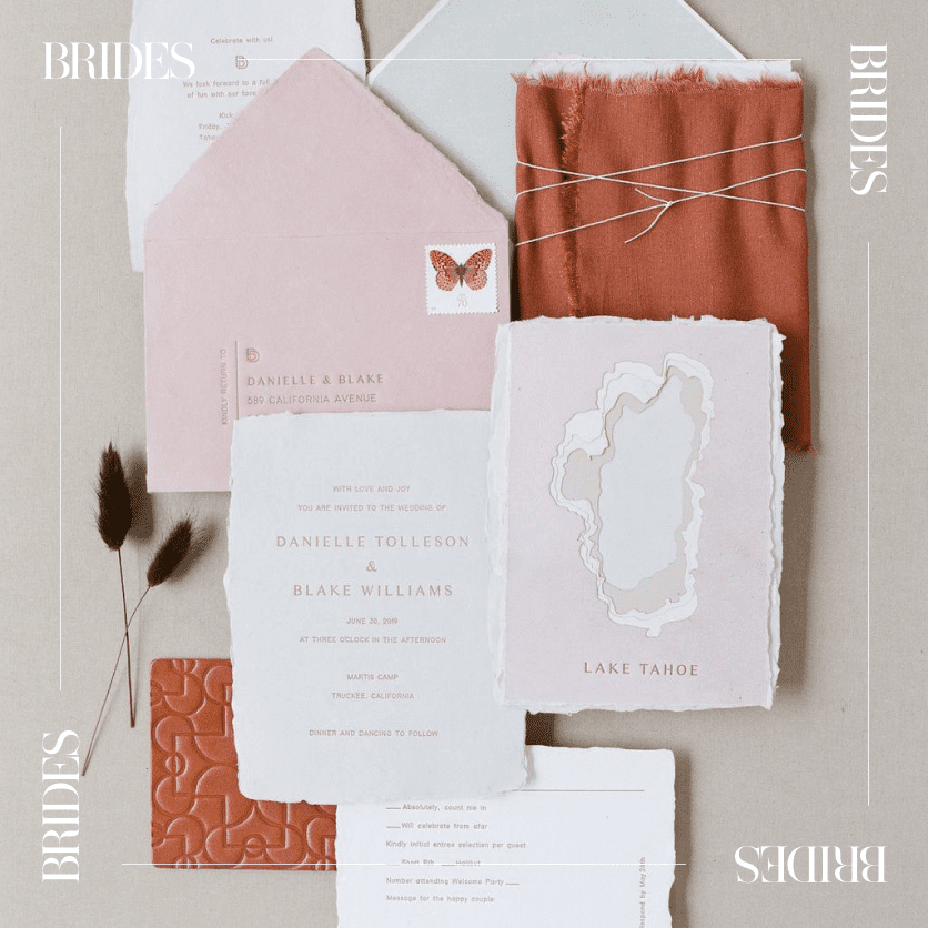 pink and clay deckled edge lake tahoe invitation suite with butterfly stamp on light gray background.